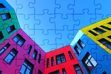 Multi-colored facades of a buildong jigsaw puzzle