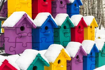 Birdhouse in winter. The snow on the birdhouse. Pl jigsaw puzzle