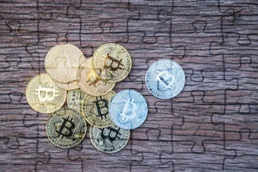 Bitcoin on wooden background. Golden bitcoin crypt jigsaw puzzle