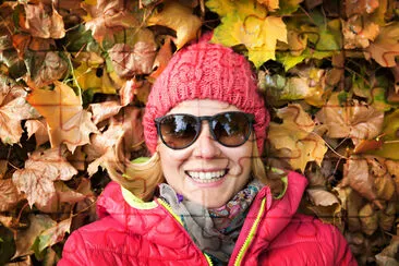 Beautiful woman lying in colorful autumn leaves jigsaw puzzle