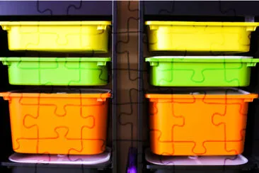 2 rows of colorful plastic containers in children jigsaw puzzle