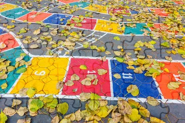 Hopscotch game painted on the floor as seen from a jigsaw puzzle