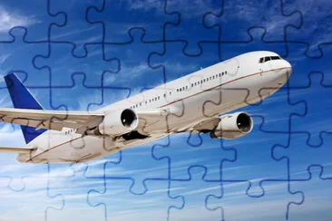 Passenger airplane flying above clouds jigsaw puzzle