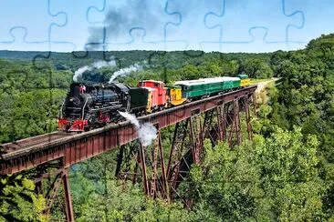 Le train à vapeur passe le pont de Bass Point Creek