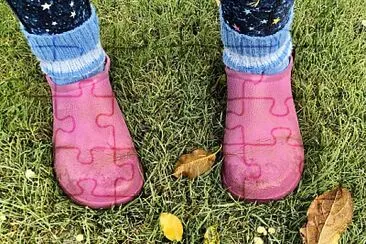 Pink boots in autumn garden jigsaw puzzle