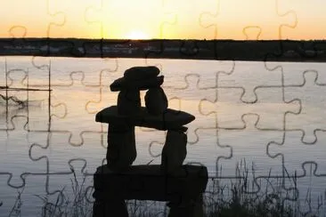 Inukshuk on the riverbank jigsaw puzzle