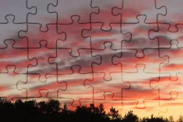 Dark pink clouds across the street jigsaw puzzle