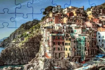 פאזל של buildings_landscape_riomaggiore_italy_coast_cliffs