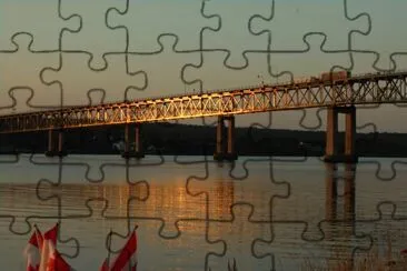 Centennial Bridge Miramichi in setting sun   L