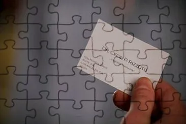 Doc Rizzuto 's card - Fractured jigsaw puzzle