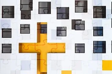 Yellow cross and white building