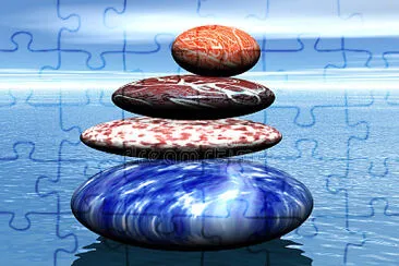 פאזל של Stack of balanced stones on the sea.