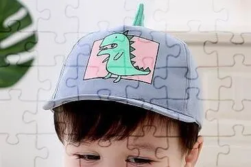 What is the kid using? jigsaw puzzle