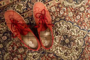 Red shoes on Kashmiri rug