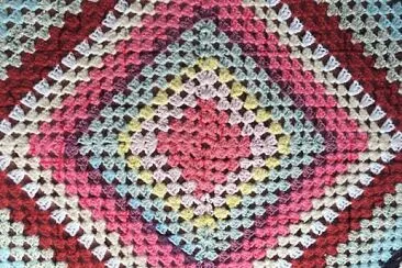 crocheted rug- pink center