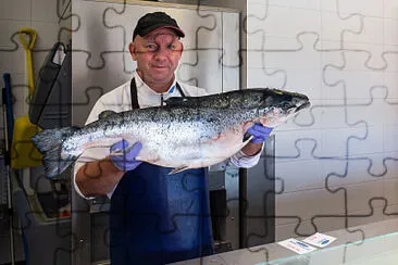 פאזל של Fish Monger Holding a Salmon