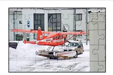 Half truck moving a small plane jigsaw puzzle