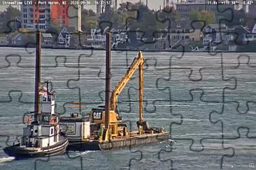 פאזל של tug Capt Keith pushing a Spud-Barge with excavator