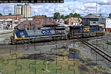 CSX-594, CSX-509 eastbound on their lone crossing jigsaw puzzle