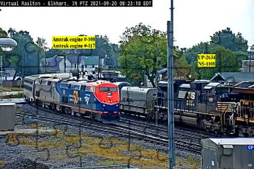 פאזל של Amtrak engines 108 and 117 overtaking oil tanker train, Elkhart,IN/USA