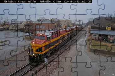 Kansas City Southern #4808 thru Parkville,MO/USA in the rain jigsaw puzzle