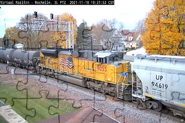 UP-9055  as mid-DPU with covered hopper UP-94619 at Rochelle, ILL