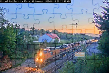 train passing the La Plata,MO/USA Amtrak Depot at La Plata,MO/USA