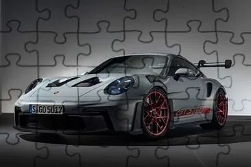 פאזל של porsche 911 gt3 is a fast car that can go 225 mph