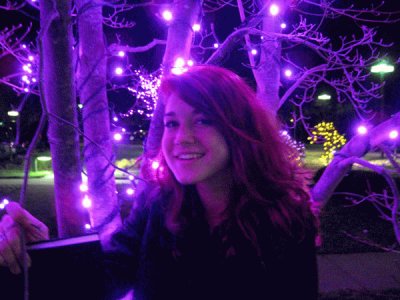 Glowing Girl Under Purple Lights