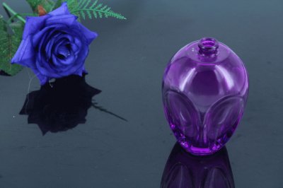 Reflecting Perfume Bottle and Rose