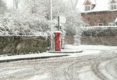 Village post box snow scene