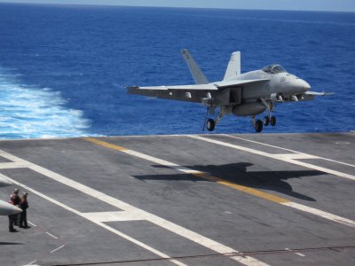 plane landing on aircraft carrier