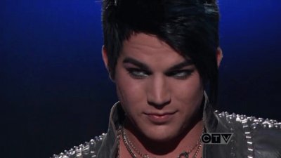 adam lambert giving simon cowel a well face