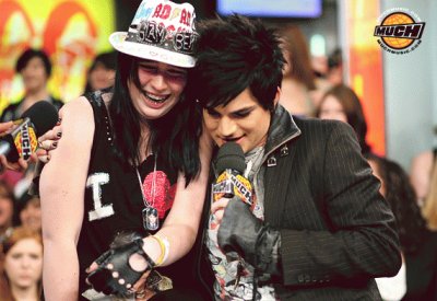 adam lambert hugging a girl