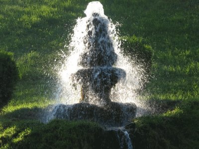 Water fountain in setting sun