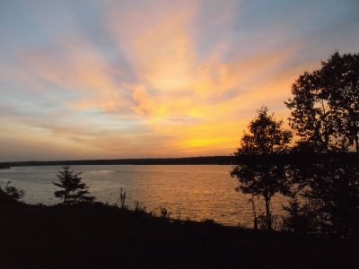 Sunrays at dusk over Miramichi River