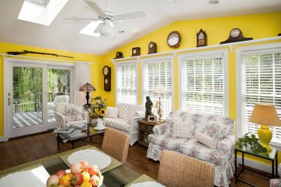 Yellow Sun Room with Antique Clocks