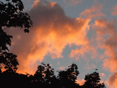 Colourful clouds over neighbour 's house