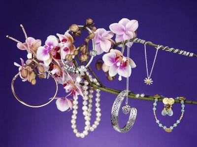 Hanging Jewelry Against Purple Back Ground